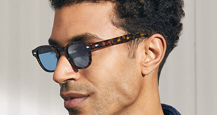 Model is wearing The LEMTOSH in Tortoise with Celebrity Blue Custom Made Tinted lenses