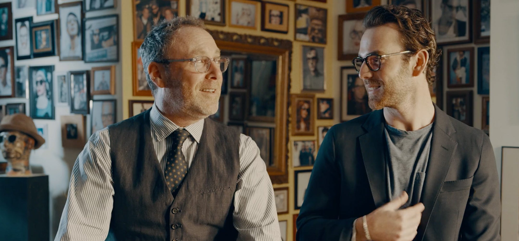 Image of two men discussing Moscot