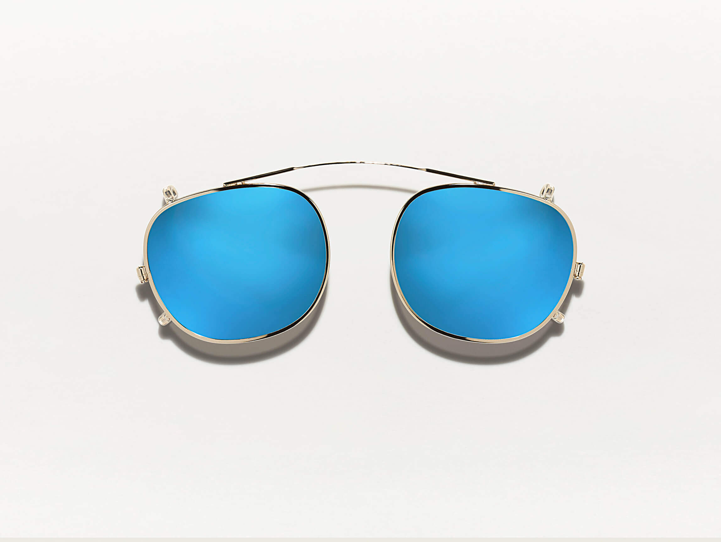 The CLIPTOSH in Gold with Blue Mirror Lenses