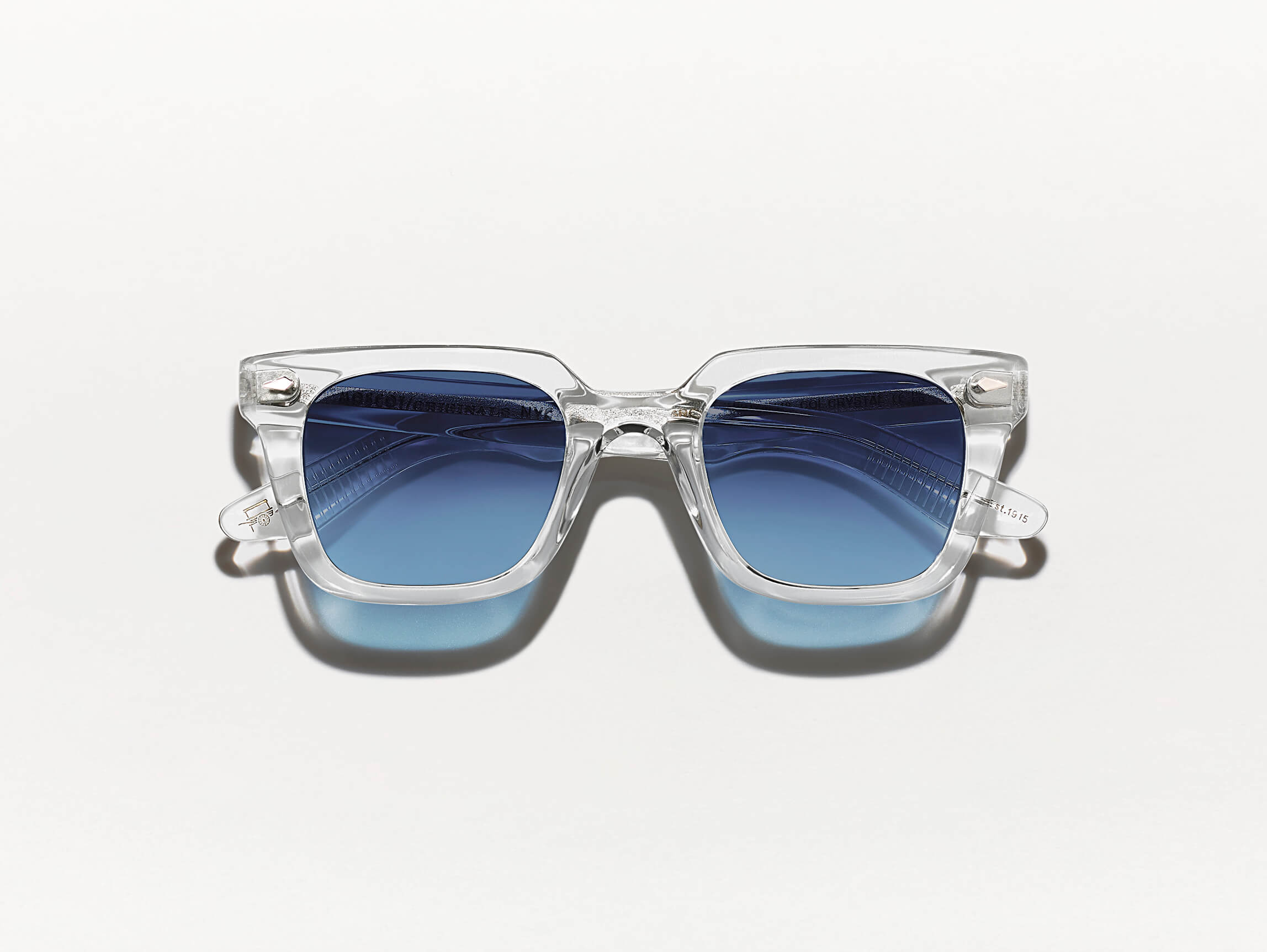 The GROBER SUN in Crystal with Denim Blue Tinted Lenses
