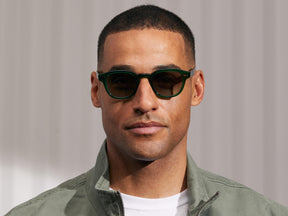 Model is wearing The LEMTOSH in Emerald in size 46 with Forest Wood Tinted Lenses