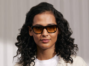 Model is wearing The NUDNIK SUN in Tortoise in size 50 with Amber Tinted Lenses