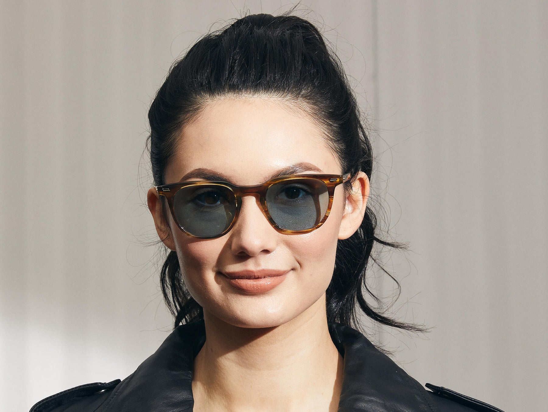 Model is wearing The TATAH SUN in Bamboo in size 50 with Blue Glass Lenses