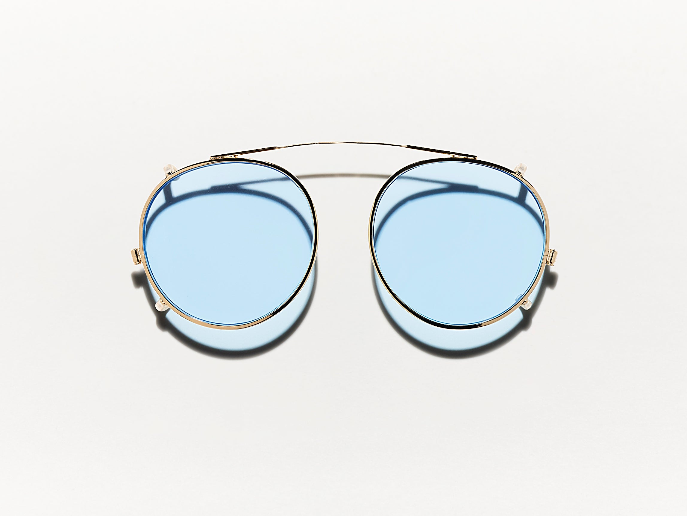 #color_bel air blue | The CLIPZEN in Gold with Bel Air Blue Tinted Lenses