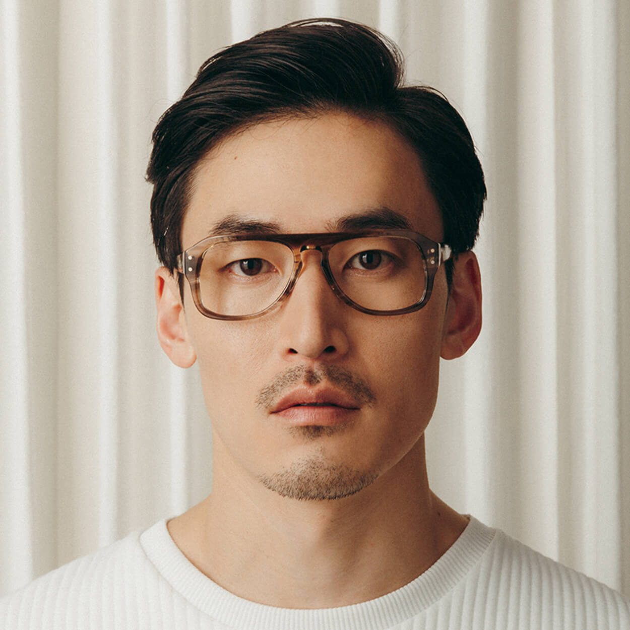 Man in thick rimmed glasses
