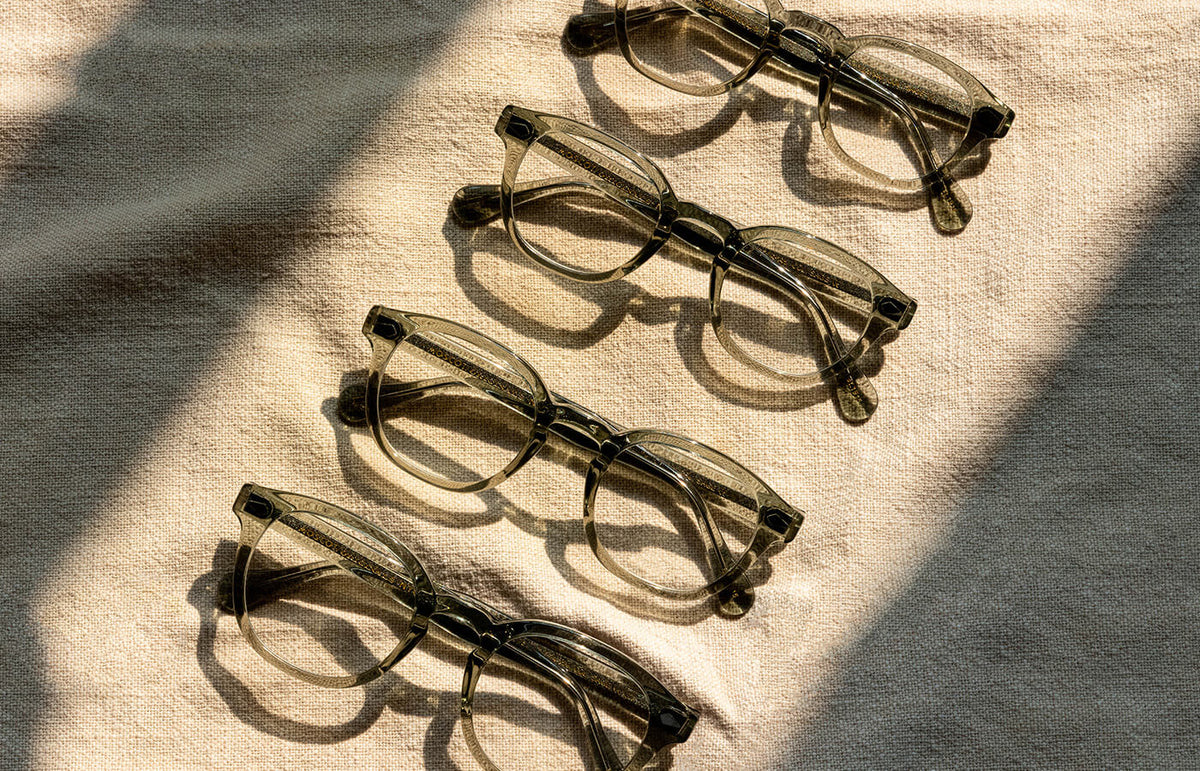GREEN EYEGLASES AND SUNGLASSES