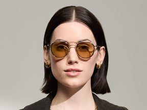 Model is wearing The ZEV CLIP in Gold in size 49 with Amber Tinted Lenses