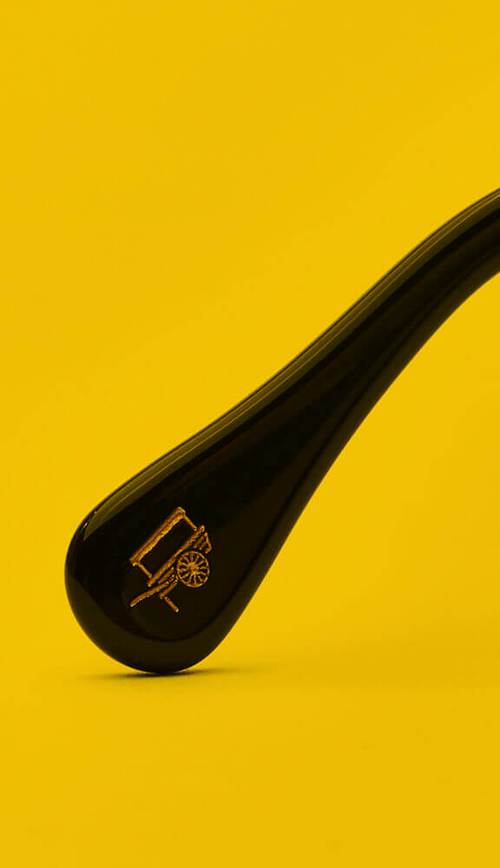 An acetate temple tip featuring the MOSCOT logo
