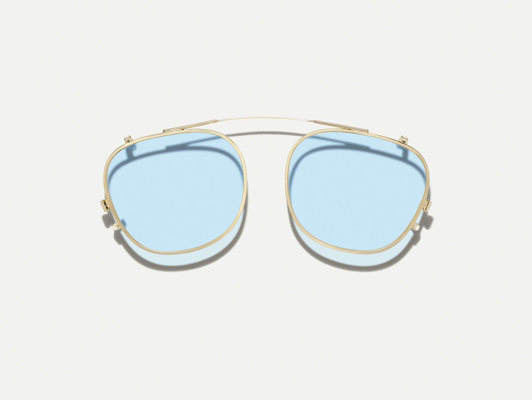 The ARTHUR CLIP  in Gold with Bel Air Blue Tinted Lenses