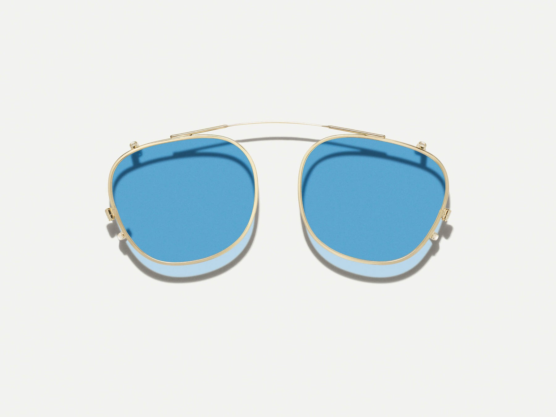 The ARTHUR CLIP  in Gold with Celebrity Blue Tinted Lenses