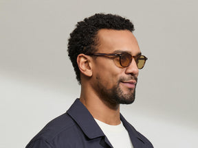 Model is wearing The ARTHUR in Tobacco in size 48 with Amber Tinted Lenses