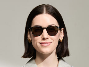 Model is wearing The ARTHUR SUN in Black in size 51 with G-15 Tinted Lenses