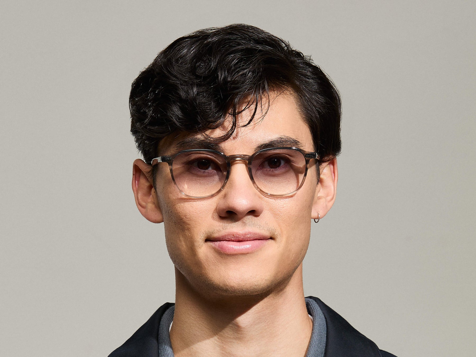 Model is wearing The ARTHUR SUN in Charcoal in size 51 with American Grey Fade Tinted Lenses