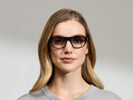 Model is wearing The AVRAM in size 54 in Black with American Grey Fade Tinted Lenses