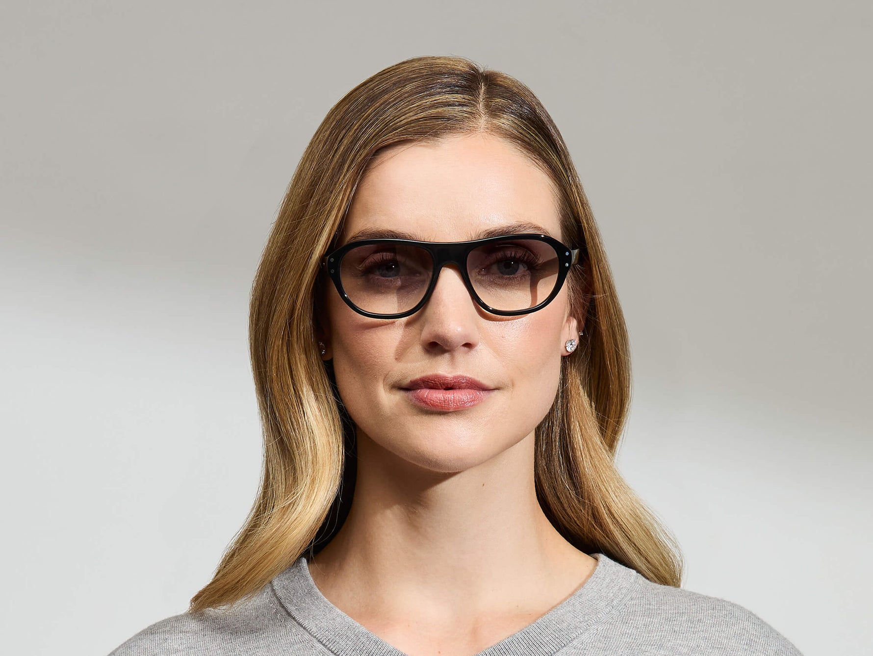Model is wearing The AVRAM in size 54 in Black with American Grey Fade Tinted Lenses