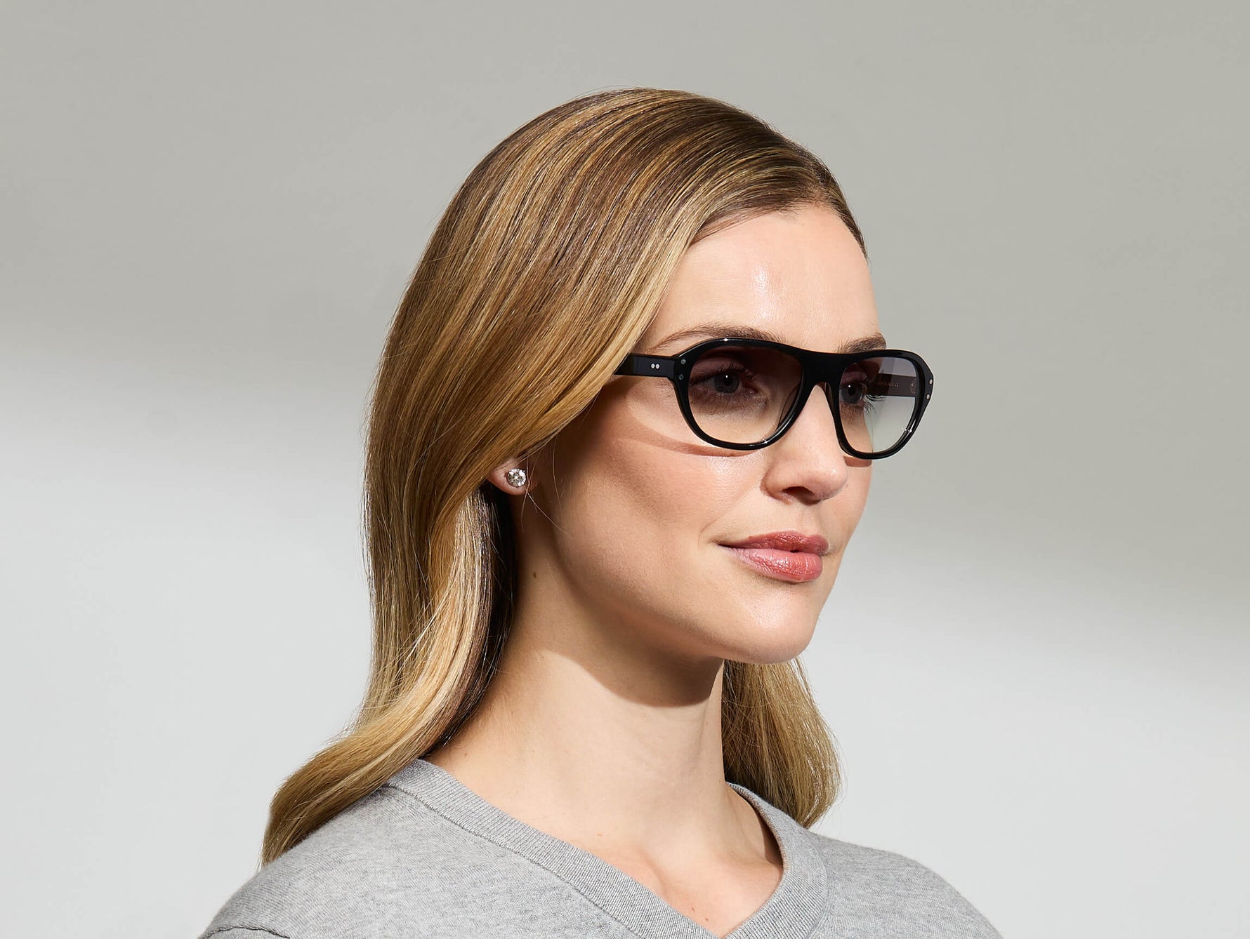 Model is wearing The AVRAM in size 54 in Black with American Grey Fade Tinted Lenses