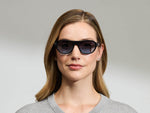 Model is wearing The AVRAM in size 54 in Black with Denim Blue Tinted Lenses
