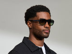 Model is wearing The AVRAM in size 54 in Black with Forest Wood Tinted Lenses