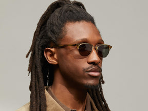 Model is wearing The AYGEN SUN in size 51 in Bamboo with G-15 Tinted Lenses