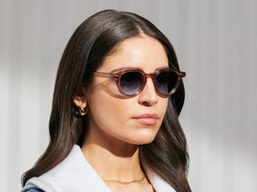 Model is wearing The BAITSIM SUN in Vintage Rose in size 48 with Denim Blue Tinted Lenses