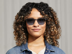 Model is wearing The BILLIK SUN in Light Blue in size 50 with Denim Blue Tinted Lenses
