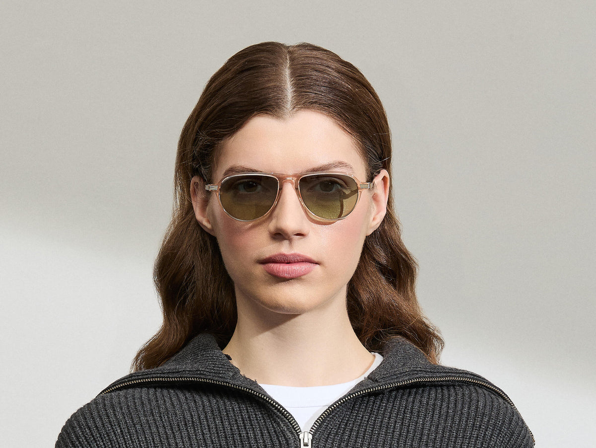 Model is wearing The BISHEART SUN in size 52 in Cinnamon with Forest Wood Tinted Lenses