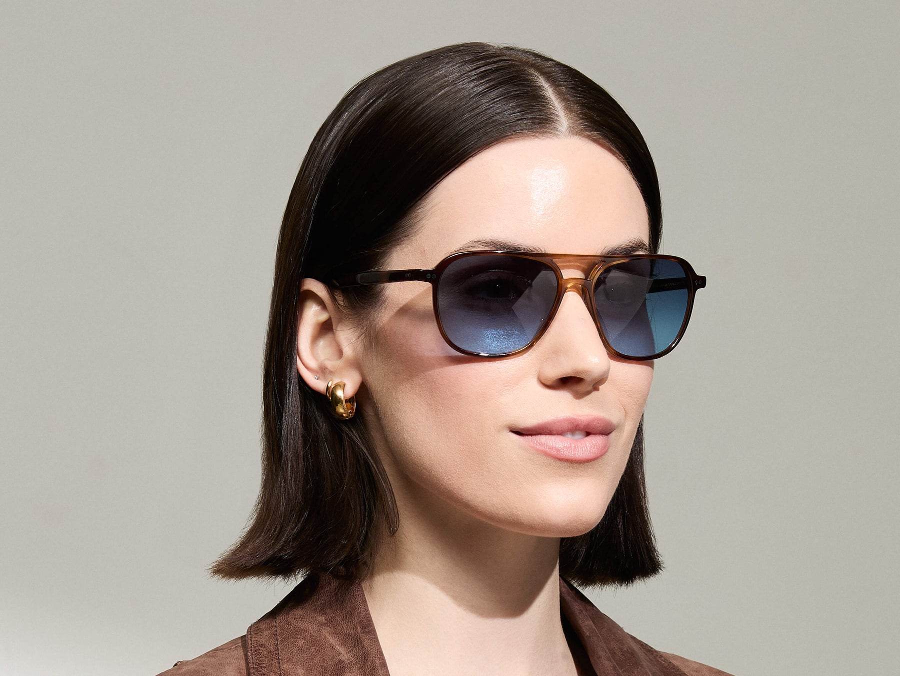 Model is wearing The BJORN SUN in Tobacco in size 58 with Denim Blue Tinted Lenses
