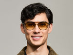 Model is wearing The BJORN SUN in Bamboo in size 58 with Chestnut Fade Tinted Lenses