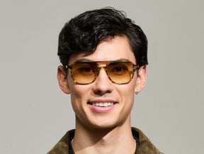 Model is wearing The BJORN SUN in Bamboo in size 58 with Chestnut Fade Tinted Lenses