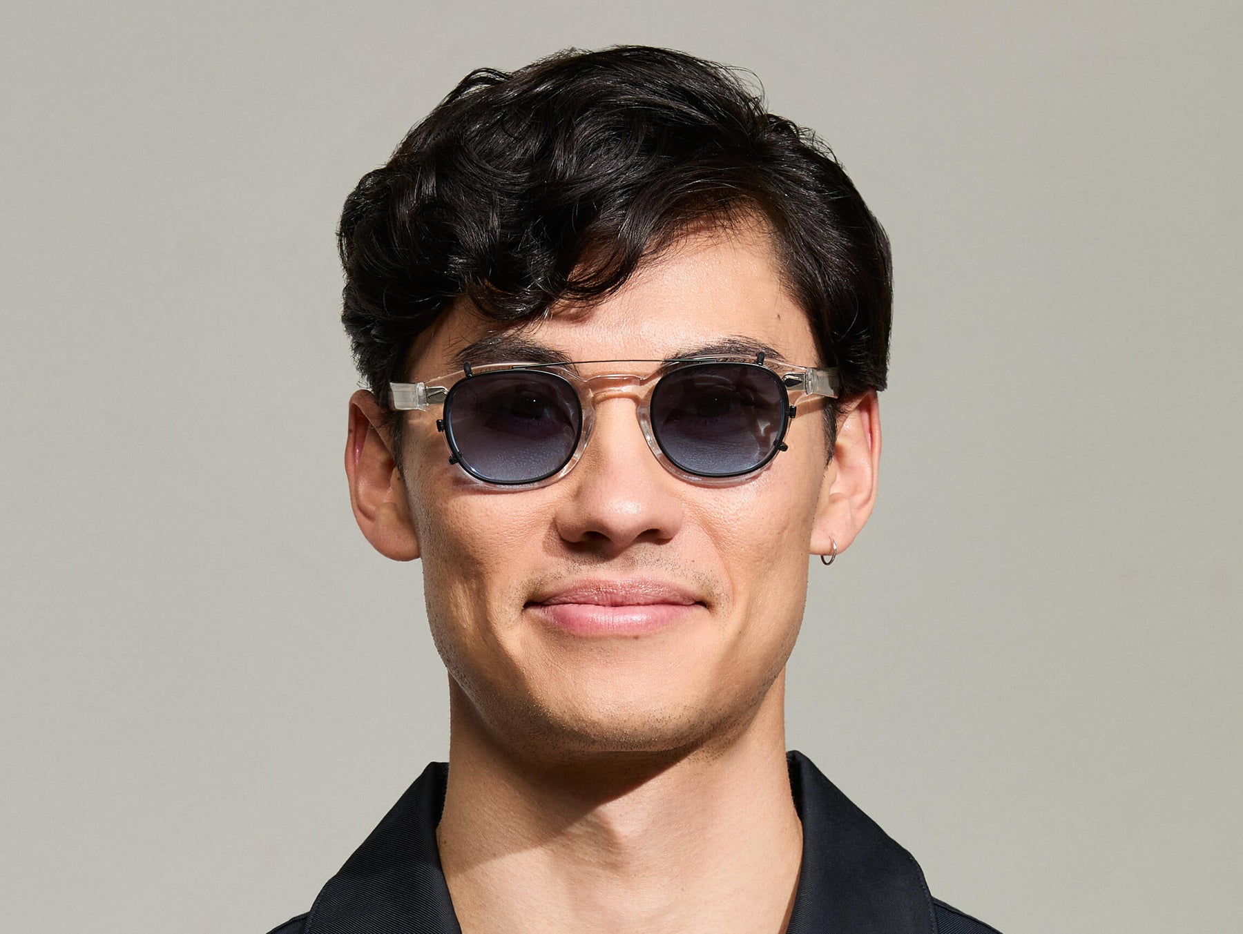 The Model is wearing The CLIPTOSH in Matte Black in size 46 with Denim Blue Tinted Lenses