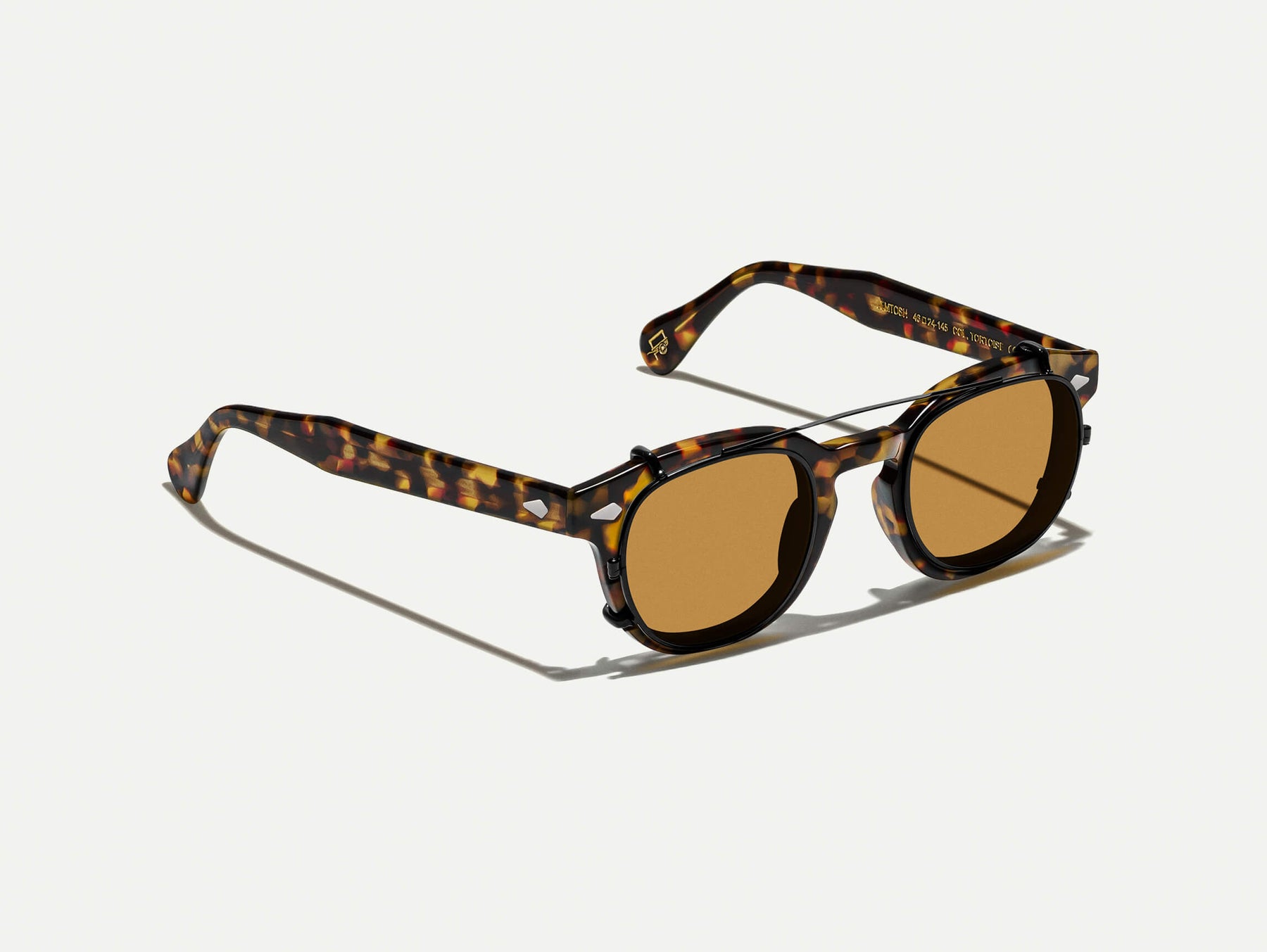 The CLIPTOSH in Matte Black with Amber Tinted Lenses