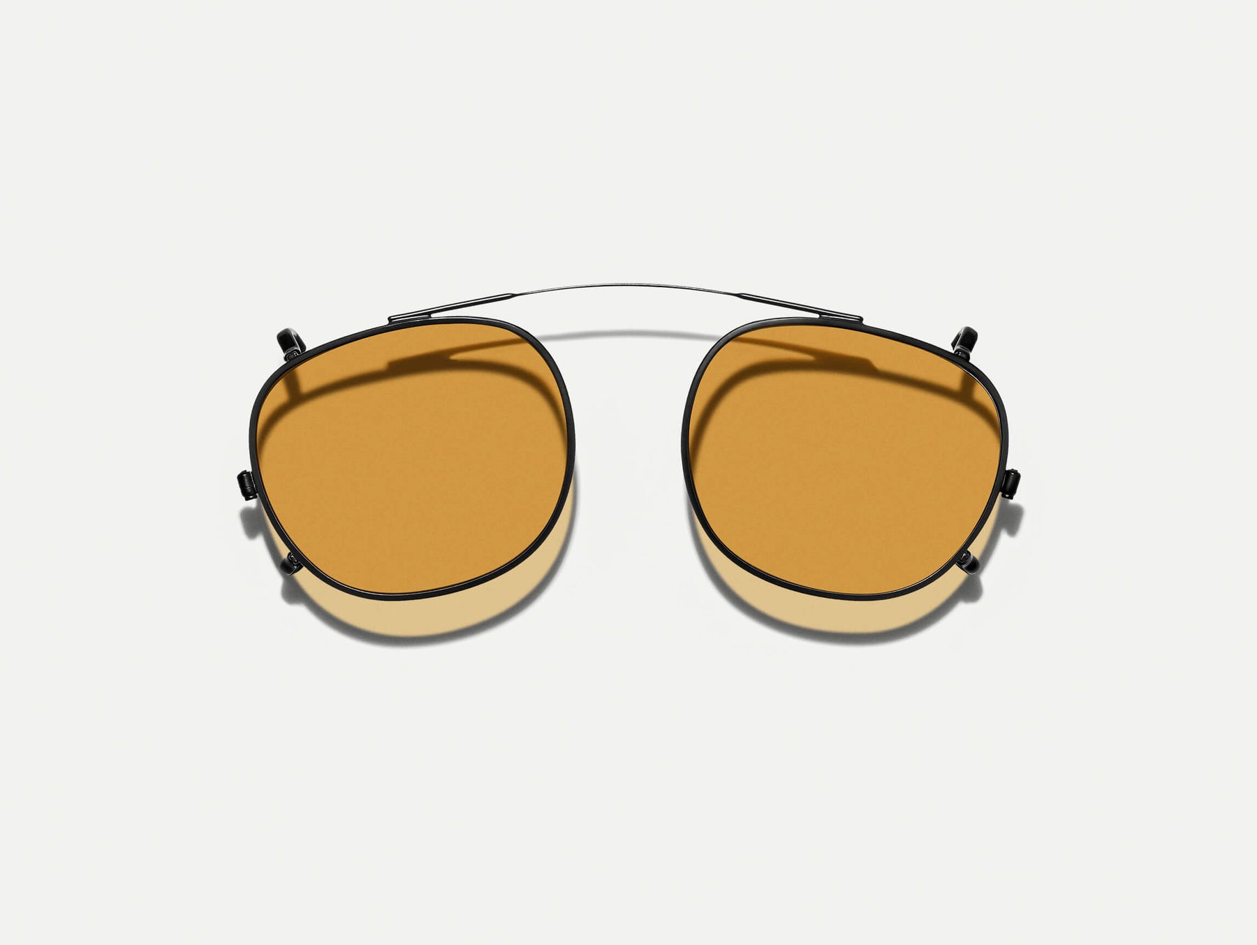 The CLIPTOSH in Matte Black with Amber Tinted Lenses
