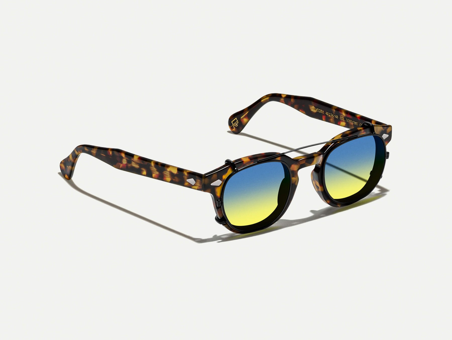 The CLIPTOSH in Matte Black with Aqua Sunrise Tinted Lenses