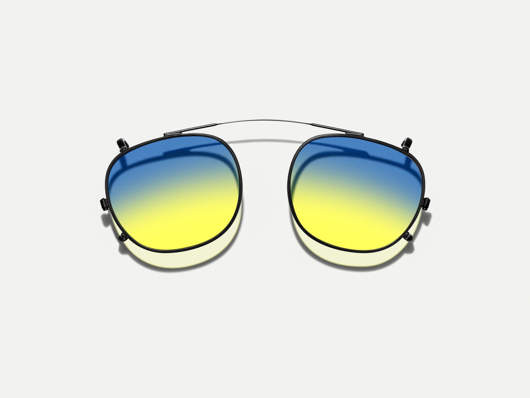 The CLIPTOSH in Matte Black with Aqua Sunrise Tinted Lenses