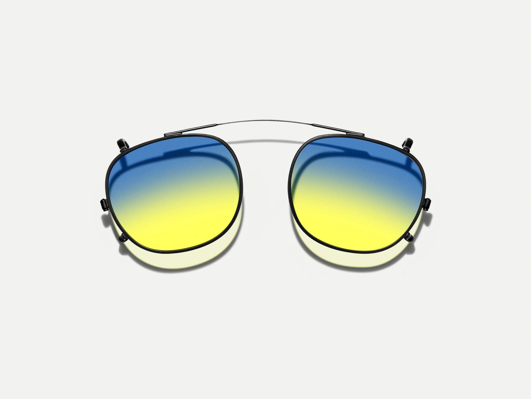 The CLIPTOSH in Matte Black with Aqua Sunrise Tinted Lenses