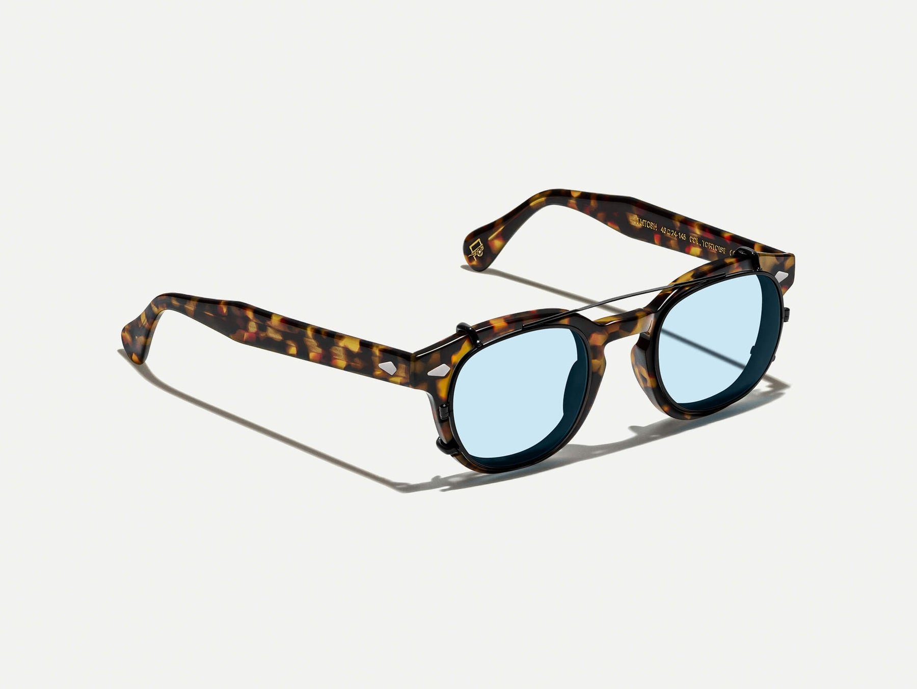 The CLIPTOSH in Matte Black with Bel Air Blue Tinted Lenses
