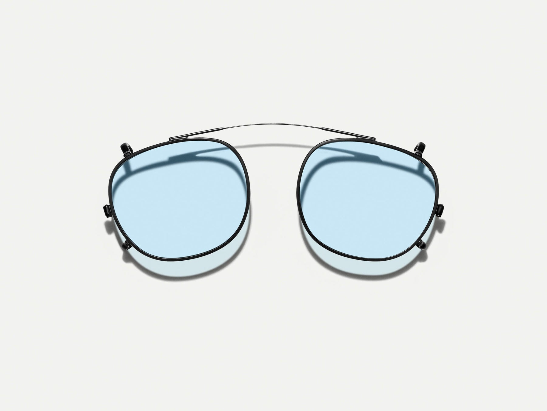 The CLIPTOSH in Matte Black with Bel Air Blue Tinted Lenses