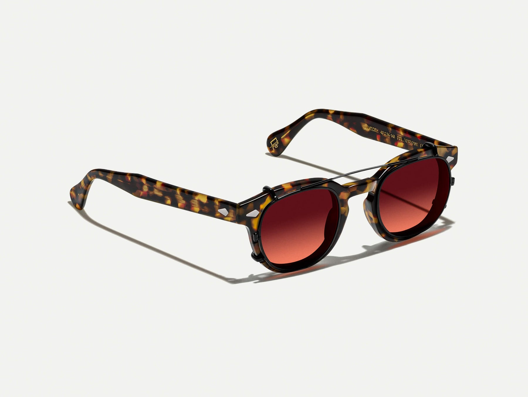 The CLIPTOSH in Matte Black with Cabernet Tinted Lenses