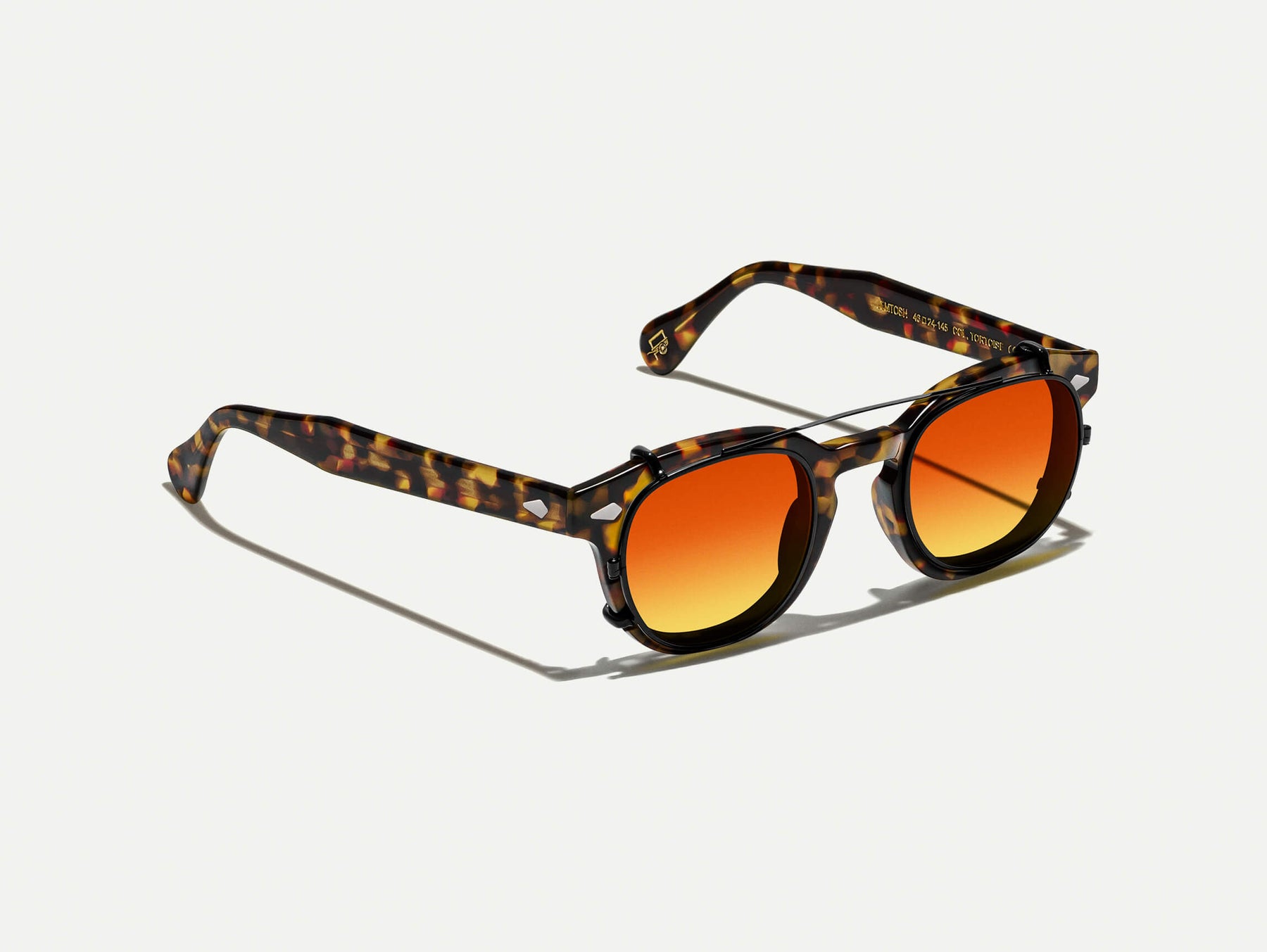 The CLIPTOSH in Matte Black with Candy Corn Tinted Lenses