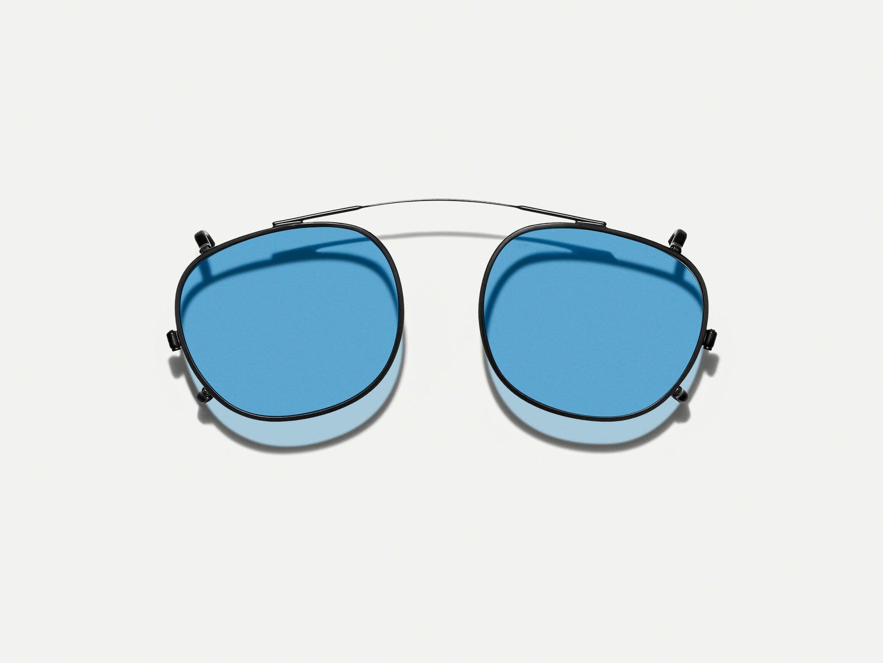 The CLIPTOSH in Matte Black with Celebrity Blue Tinted Lenses