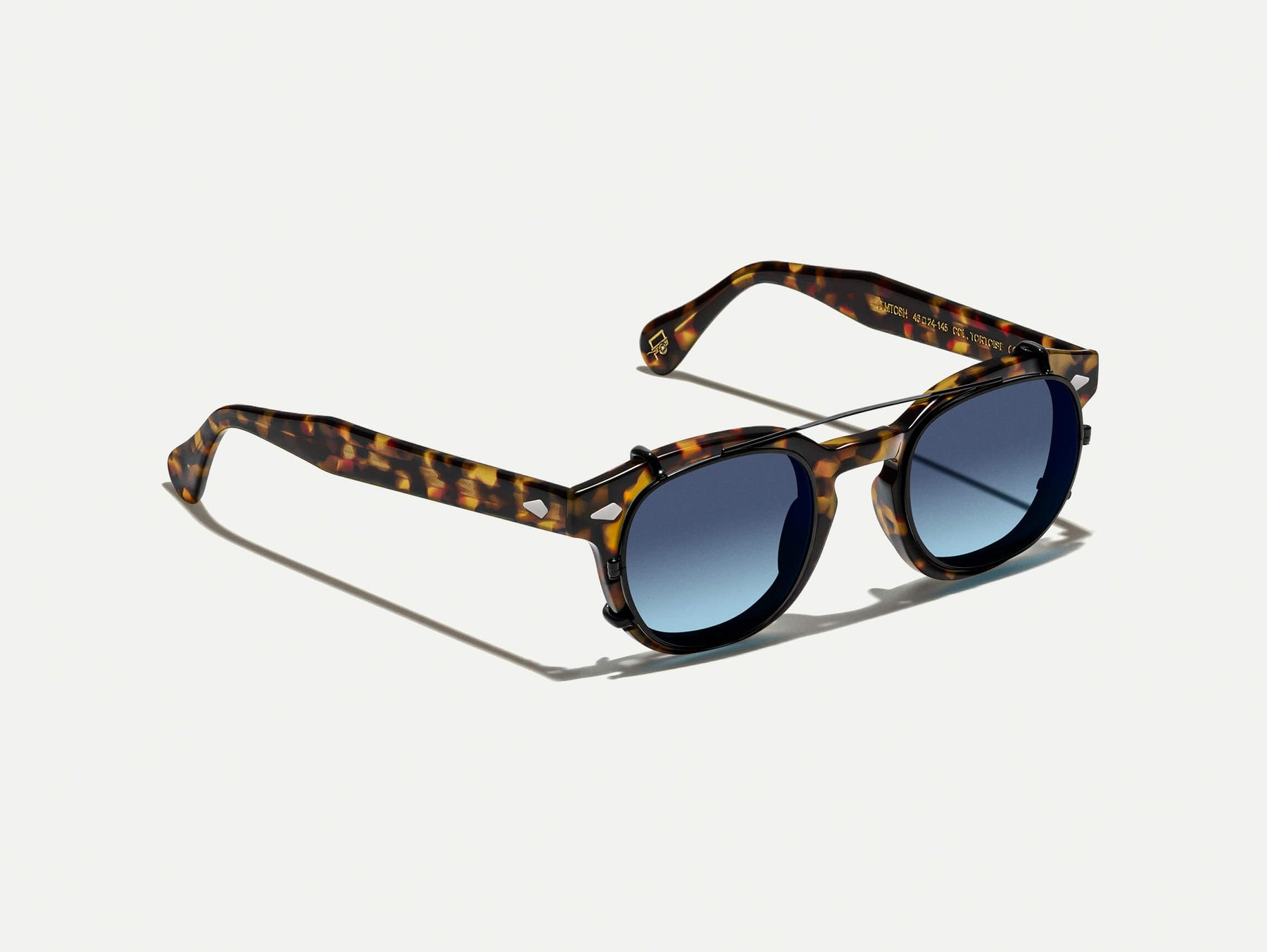 The CLIPTOSH in Matte Black with Denim Blue Tinted Lenses