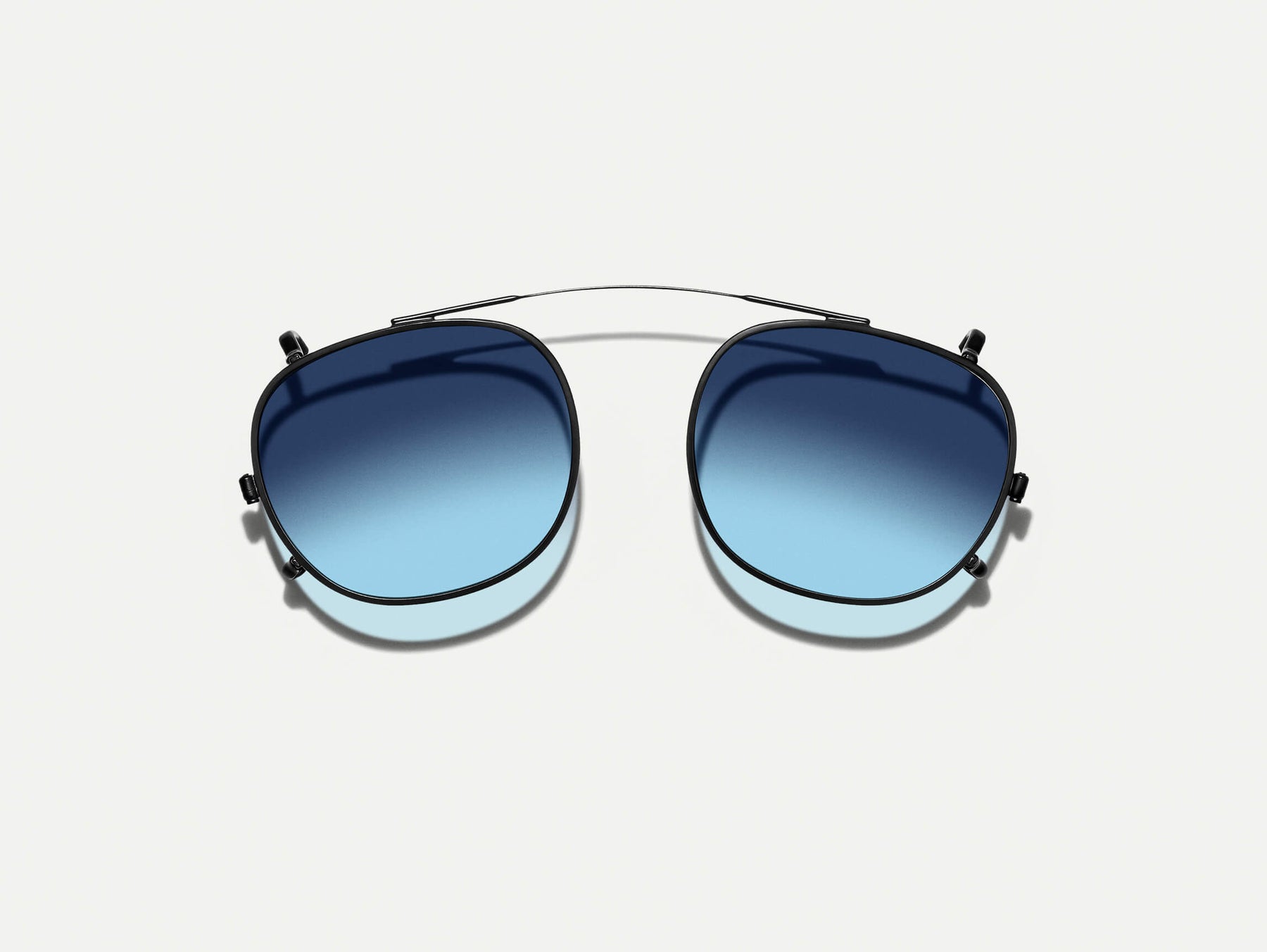 The CLIPTOSH in Matte Black with Denim Blue Tinted Lenses