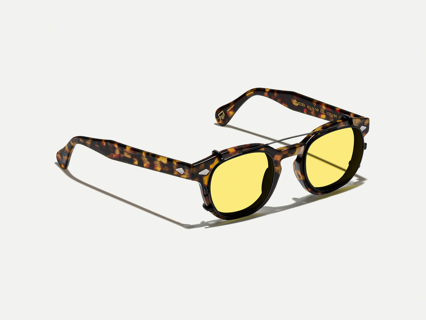 The CLIPTOSH in Matte Black with Mellow Yellow Tinted Lenses