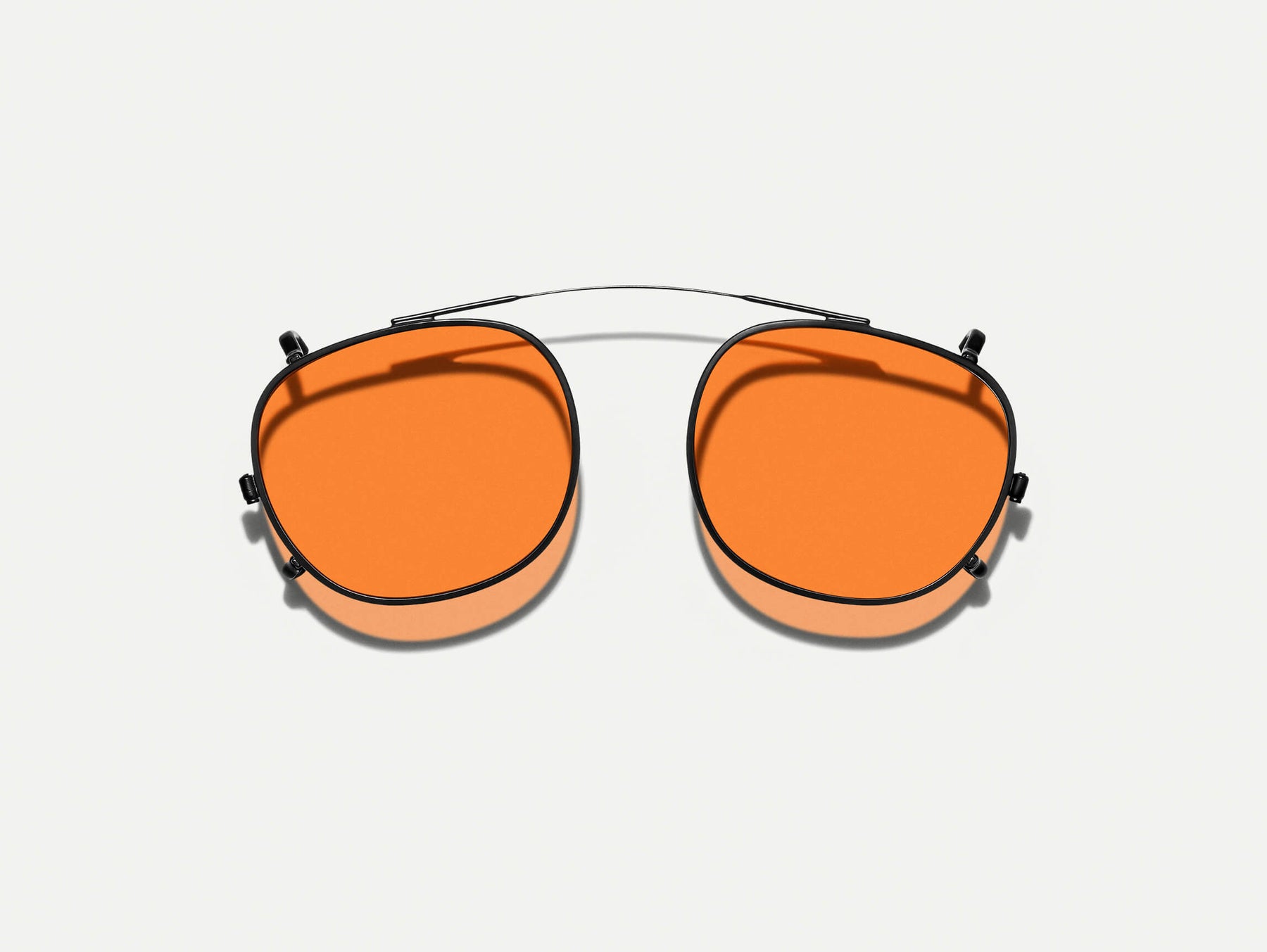 The CLIPTOSH in Matte Black with Woodstock Orange Tinted Lenses