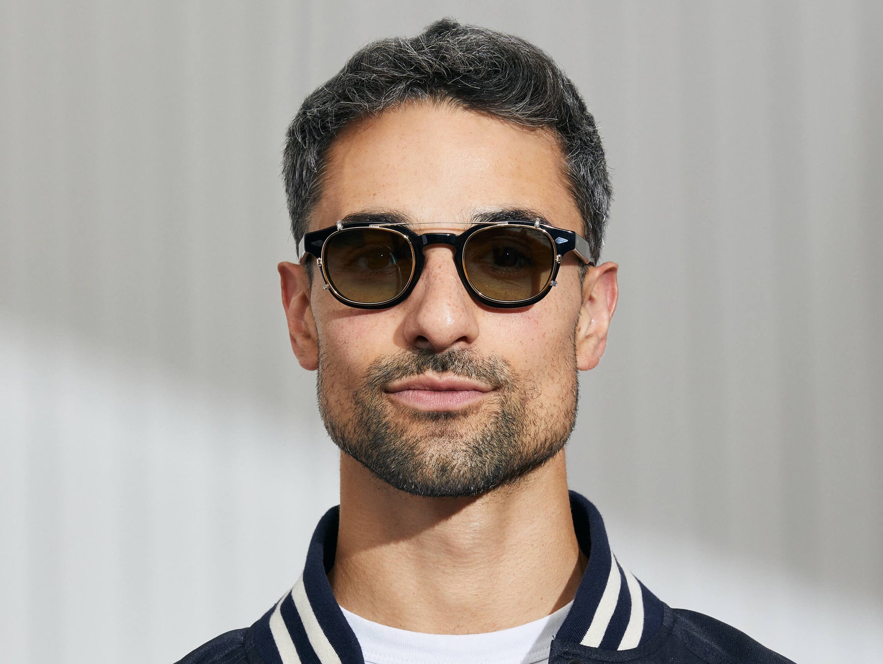 Model is wearing The CLIPTOSH in Gold in size 46 with Forest Wood Tinted Lenses