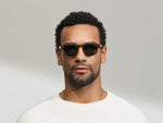 Model is wearing The CLIPTOSH POLARIZED in size 46 in Matte Black with G-15 Glass Polarized Lenses