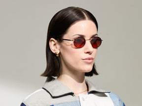Model is wearing The COSNIC SUN in  size 44 in Burgundy with Cabernet Tinted Lenses