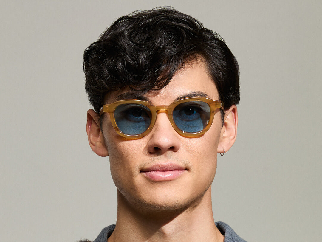 Model is wearing The DAHVEN in Blonde size 47 with BLUE+ Tinted Lenses