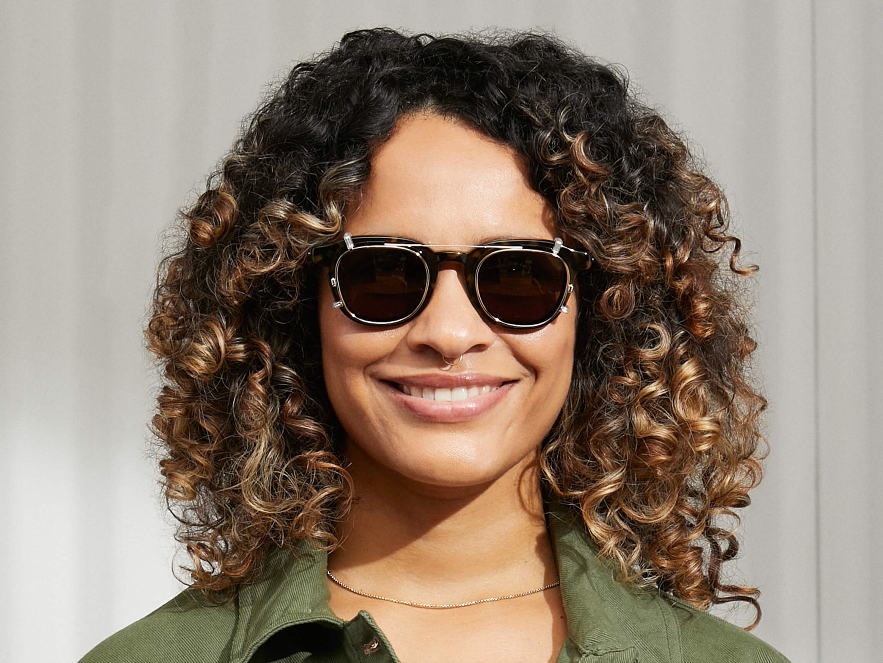 Model is wearing The DAHVEN CLIP in Gold in size 47 with G-15 Lenses