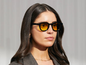 Model is wearing The DAHVEN in Black in size 47 with Mellow Yellow Tinted Lenses